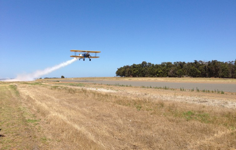 Stearman 75 taking off with smoke on