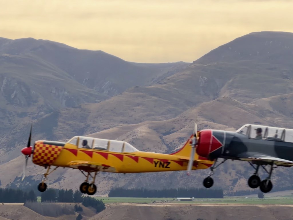 The New Zealand Yak-52 team uses these rugged trainers for an impressive display of close formation flying and aerobatics against the spectacular Wanaka mountain backdrop.